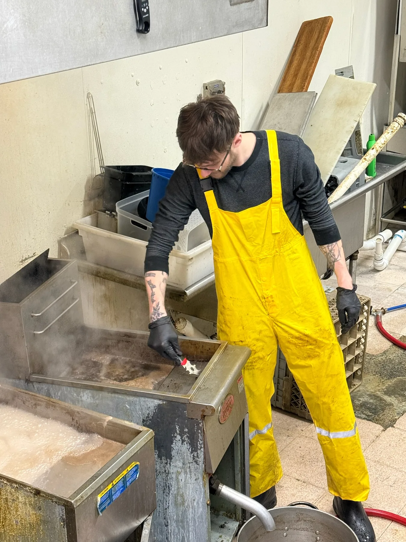 SaniDine crew member detailing kitchen equipment