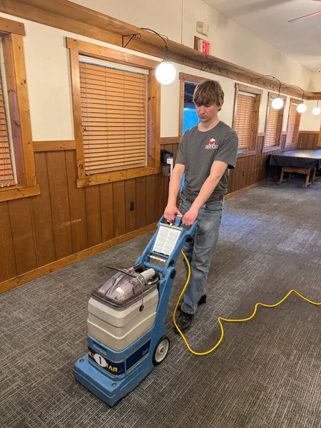 Machine cleaning a restaurant floor