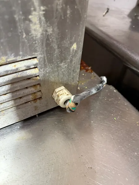 Detail cleaning a piece of kitchen equipment
