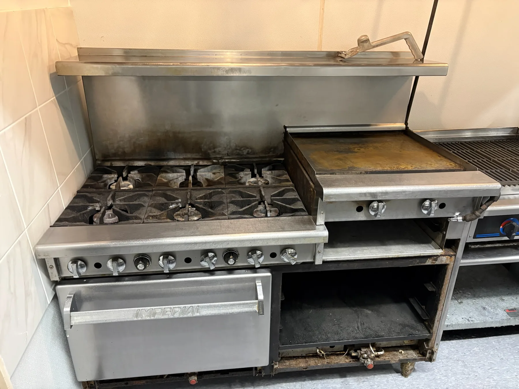 Range and griddle beneath the exhaust hood
